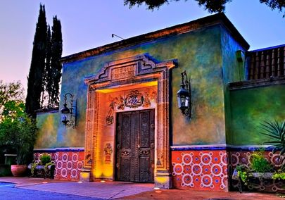 Exterior of Fonda San Miguel at night in Shoal Creek, TX